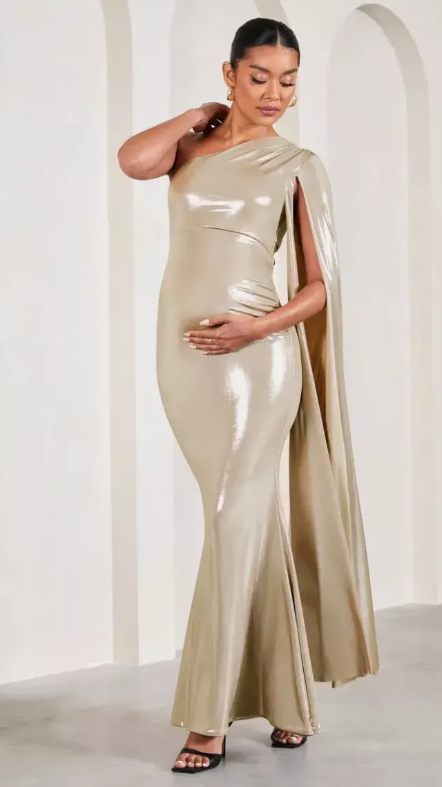 Amara Gold Metallic One-Shoulder Maternity Maxi Dress With Cape Amara Gold Metallic One Shoulder Maternity Maxi Dress With Cape